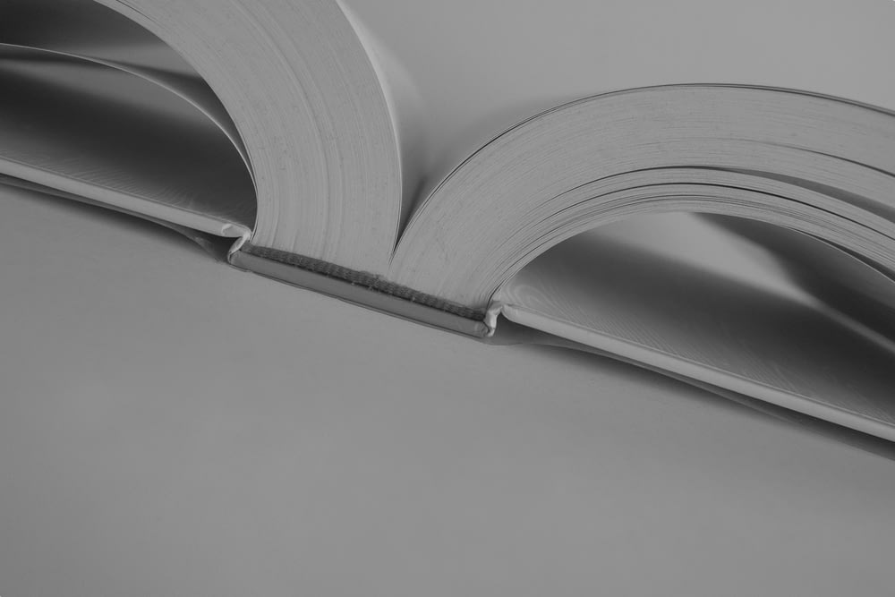 a close up of an open book on a table
