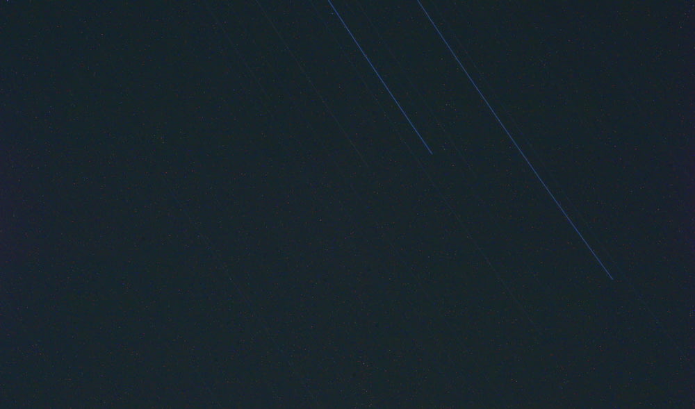 a plane flying in the sky at night