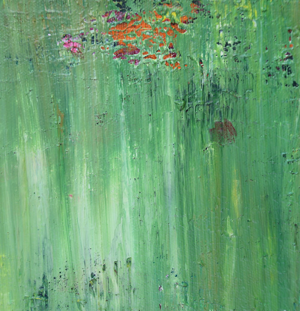 green, pink, and orange abstract painting