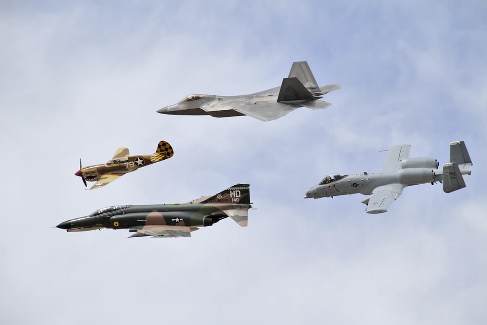 four grey jet planes