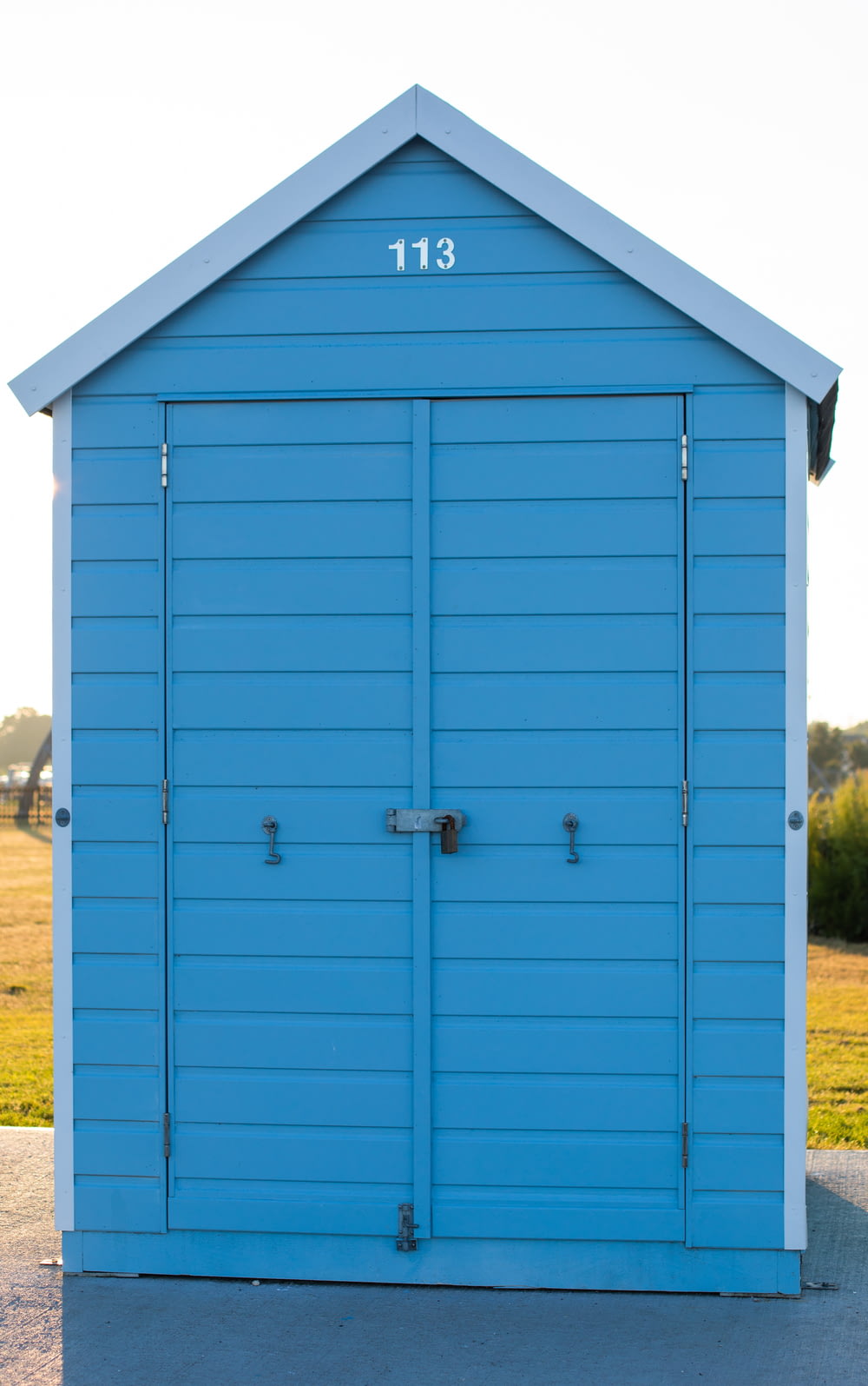 blue wooden tool shed