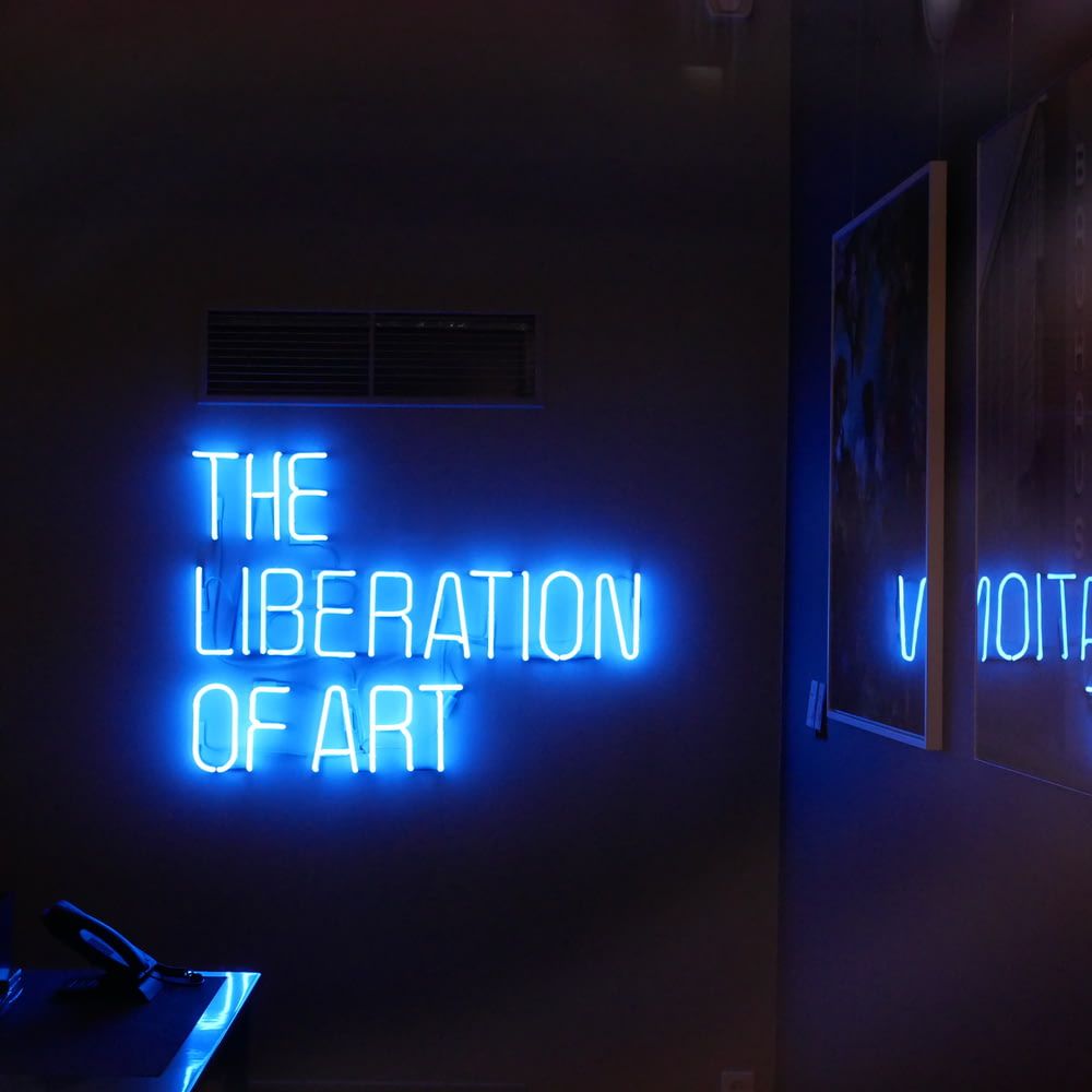 the liberation of art neon sign