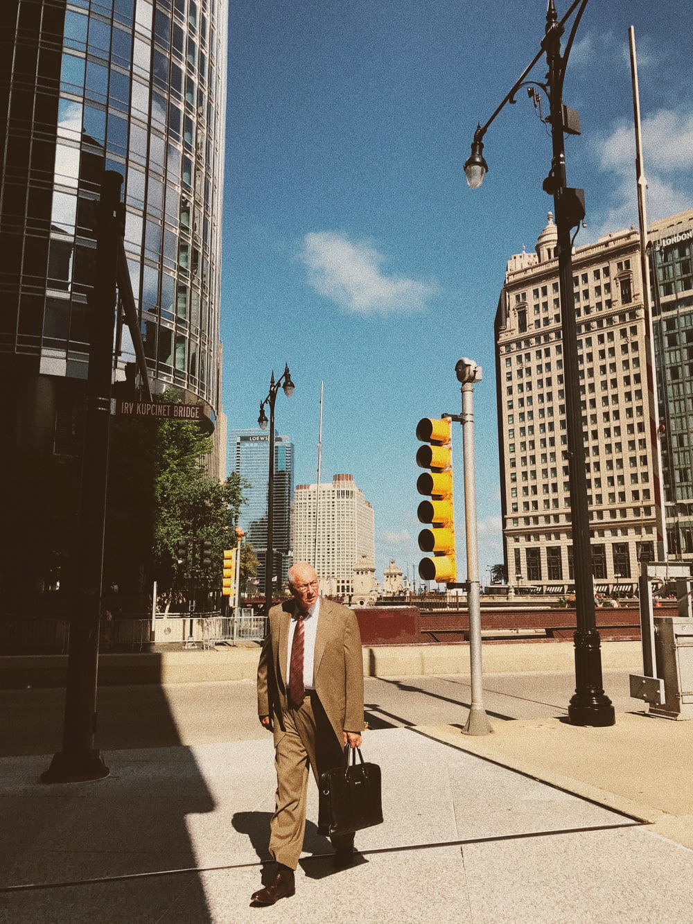 man walking near buildings during daytime