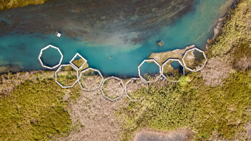 aerial photography of round shapes on land and water