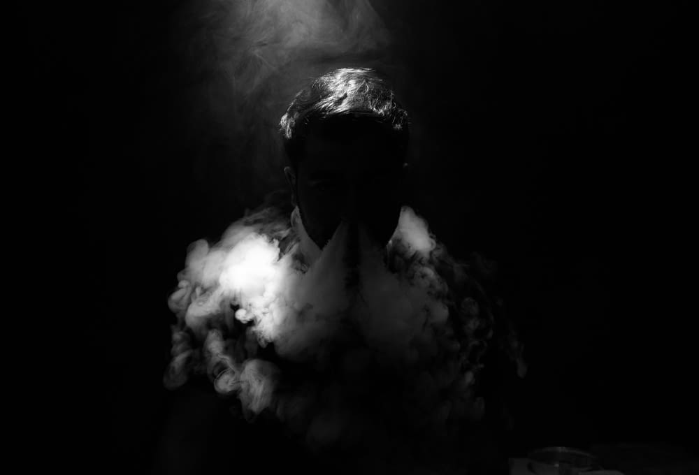 man smoking photograph
