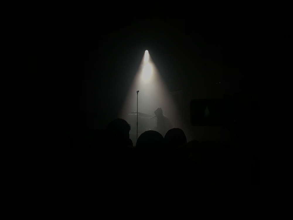silhouette of person performing on stage