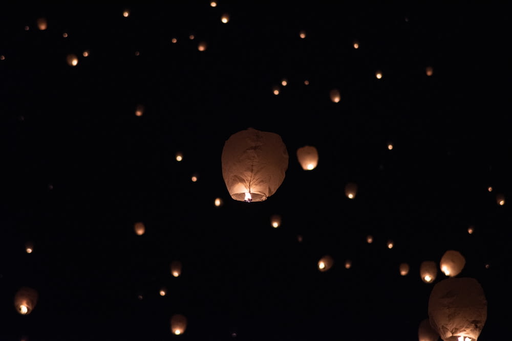 lighted sky lantern lot at night