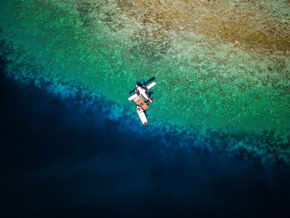 aerial photography of plane on sea