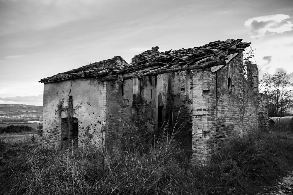 grayscale photography of abandoned house