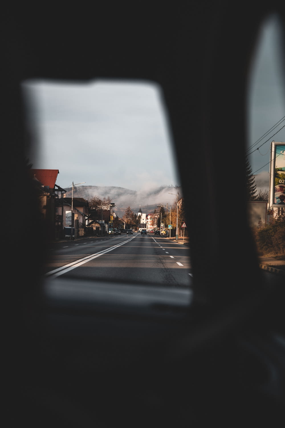 a view of a street from inside a vehicle