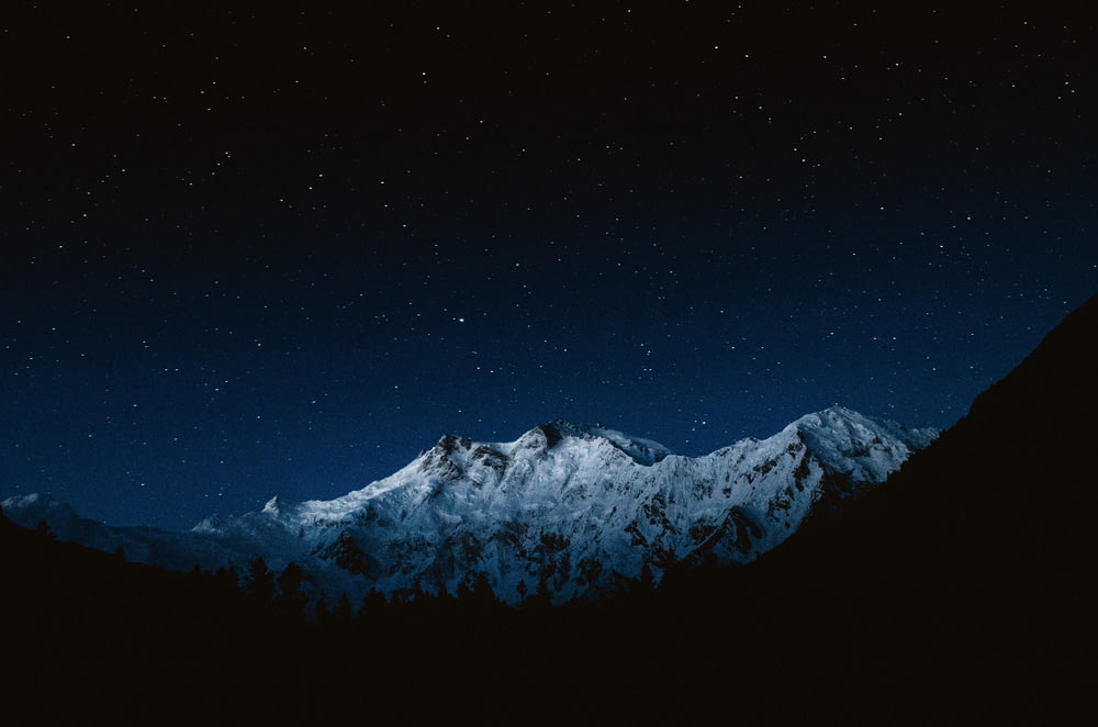 snow-capped mountain at night