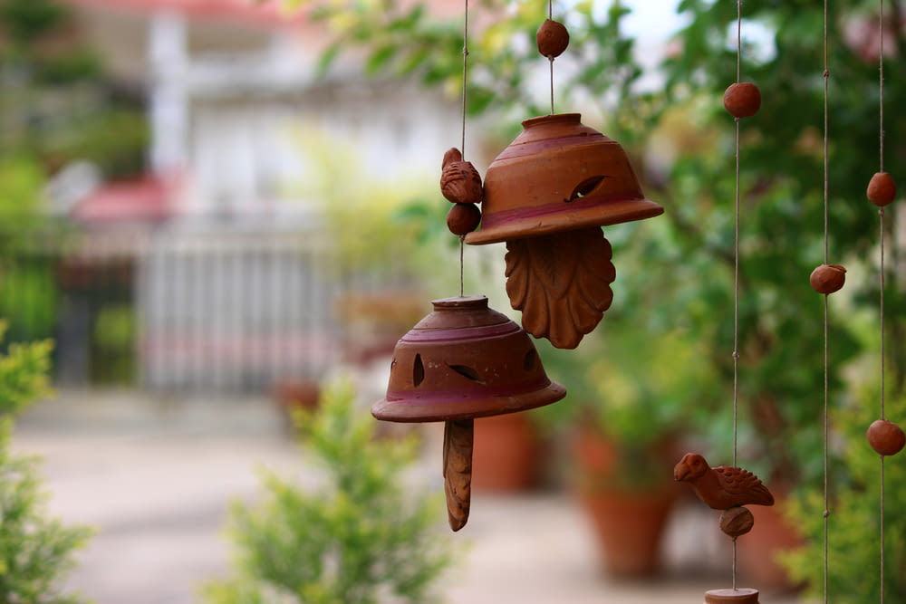 a group of bells hanging from a tree