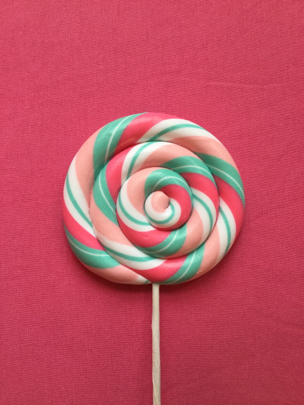 green-red-beige-and-white lollipop