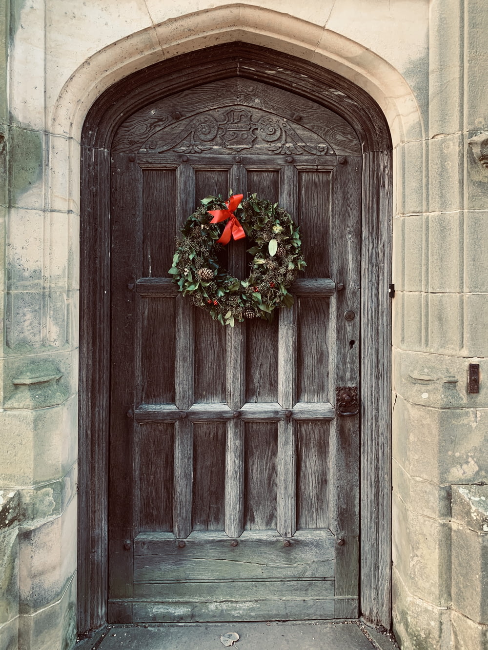 door with green wreath