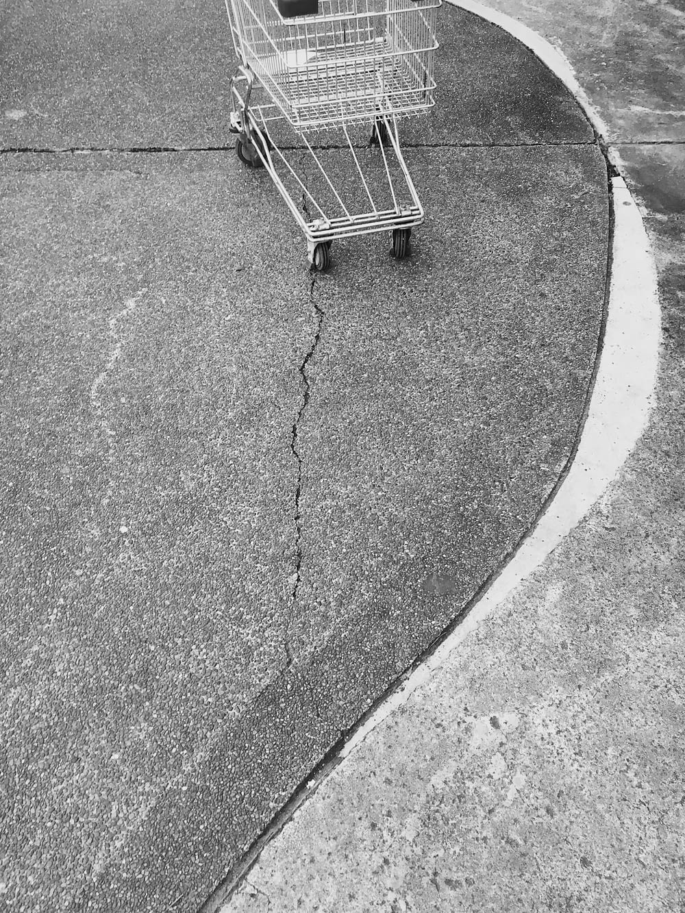 a black and white photo of a shopping cart
