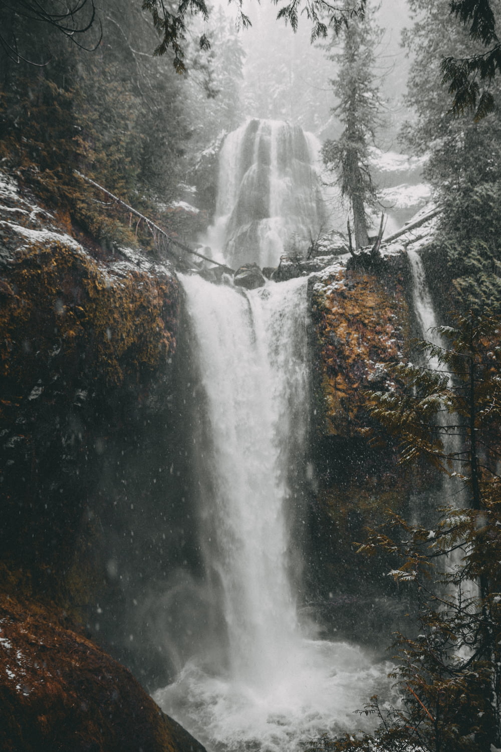 flowing waterfalls during daytime