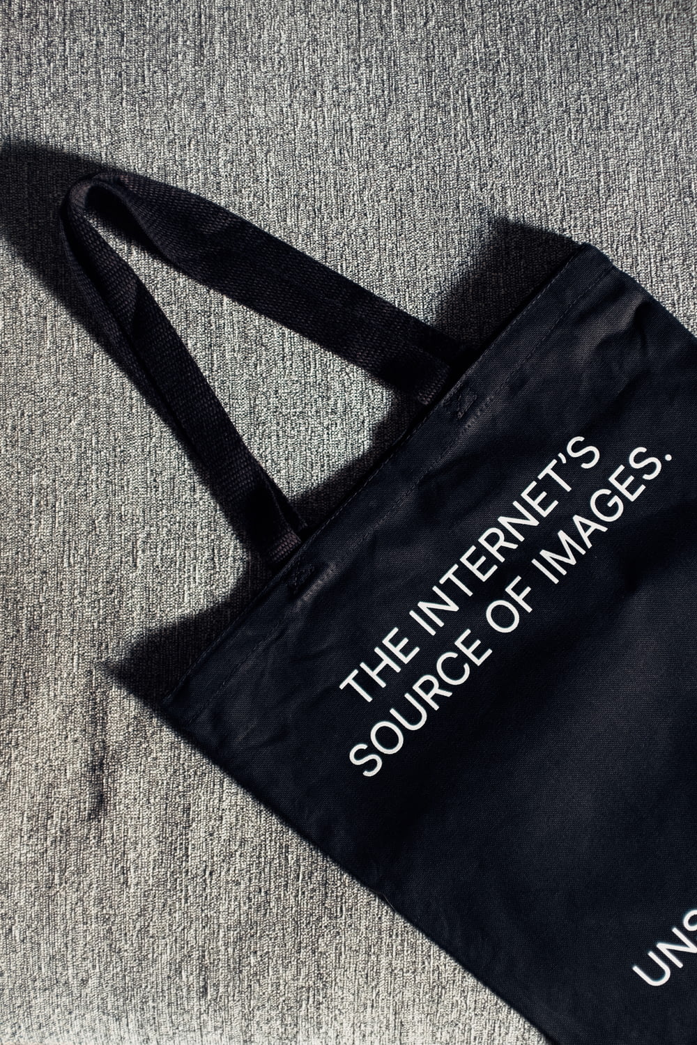 a black bag with the words the internet is source of images printed on it