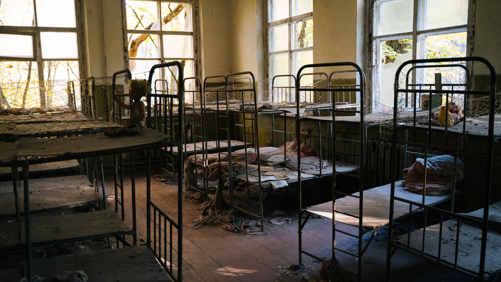 abandoned black metal beds