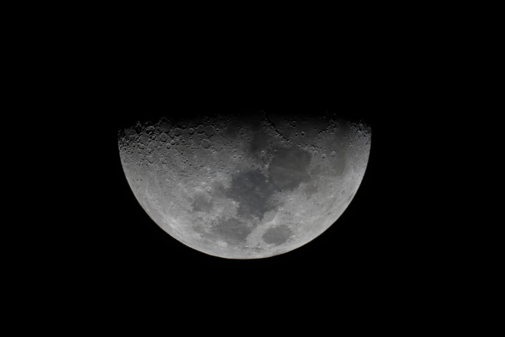 grayscale photography of half moon