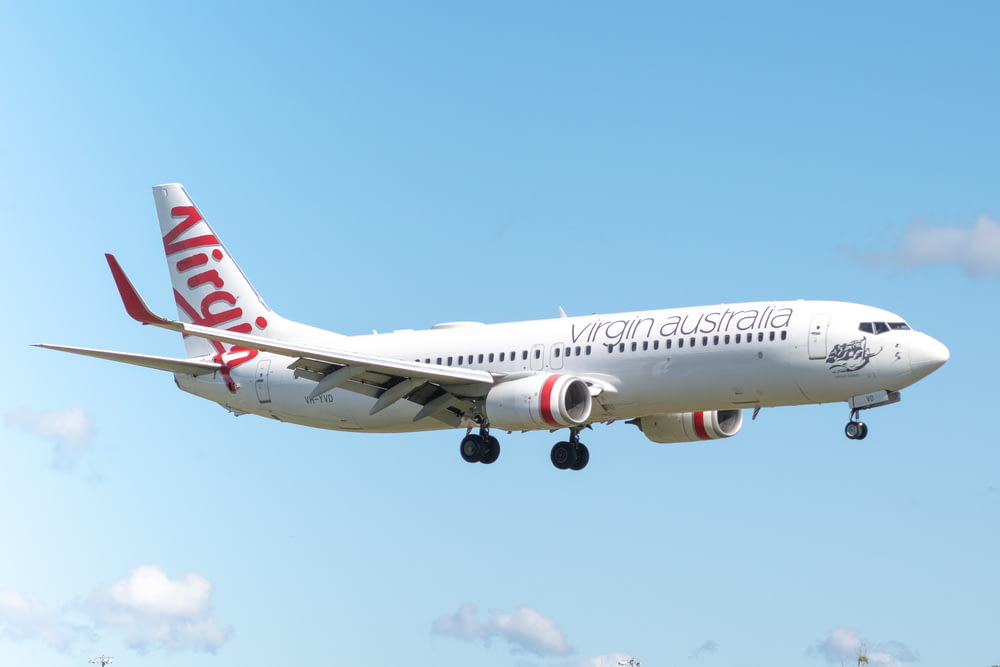 white and red Virgin Australia airplane in the sky