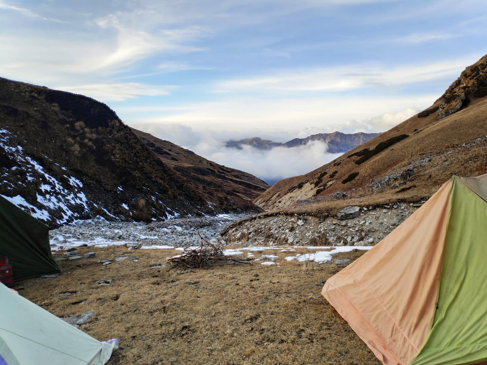 tents near mountain under white sky