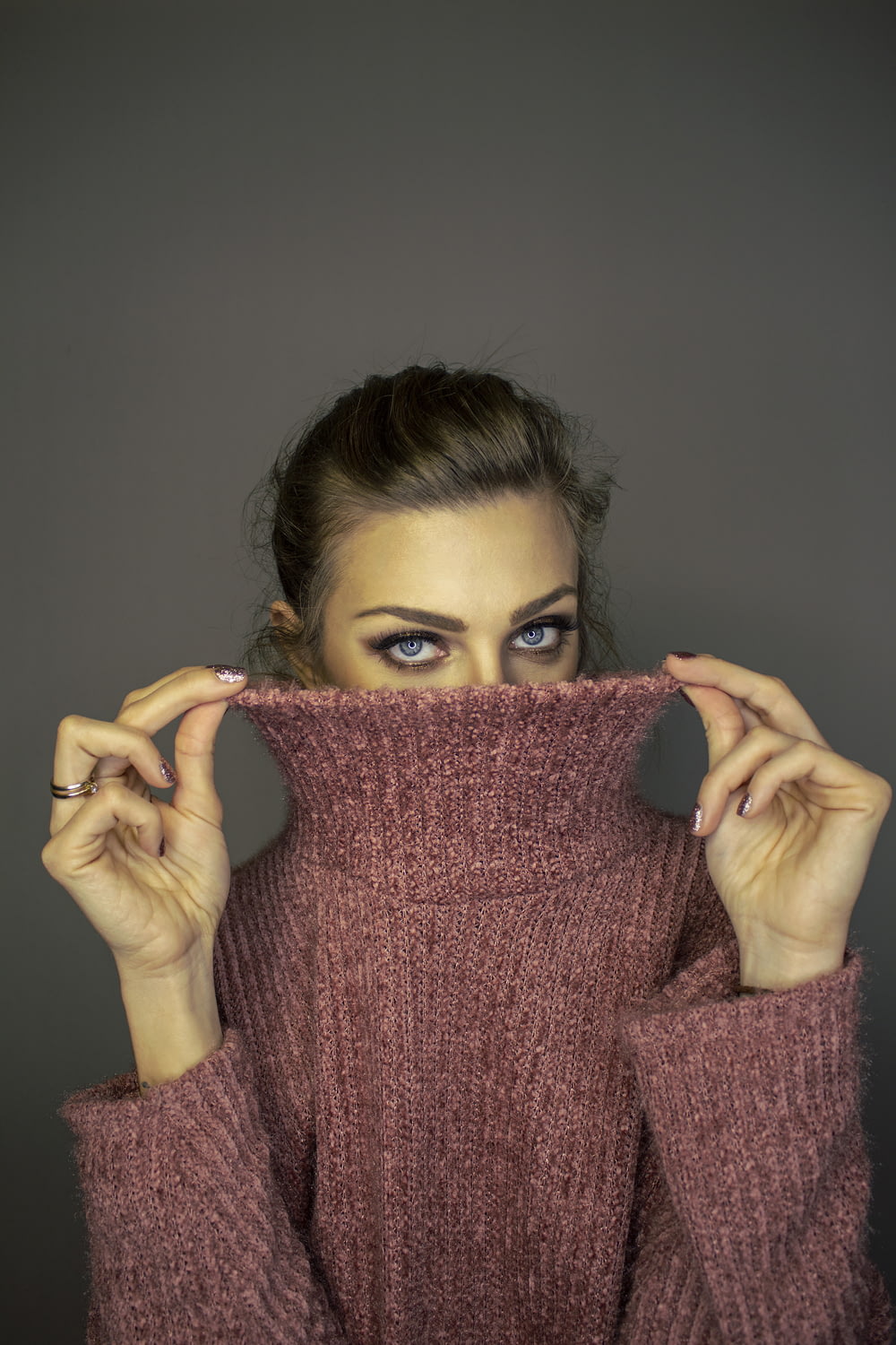 woman in pink turtleneck sweater