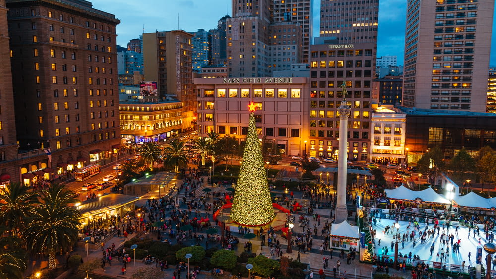 a large christmas tree in the middle of a city