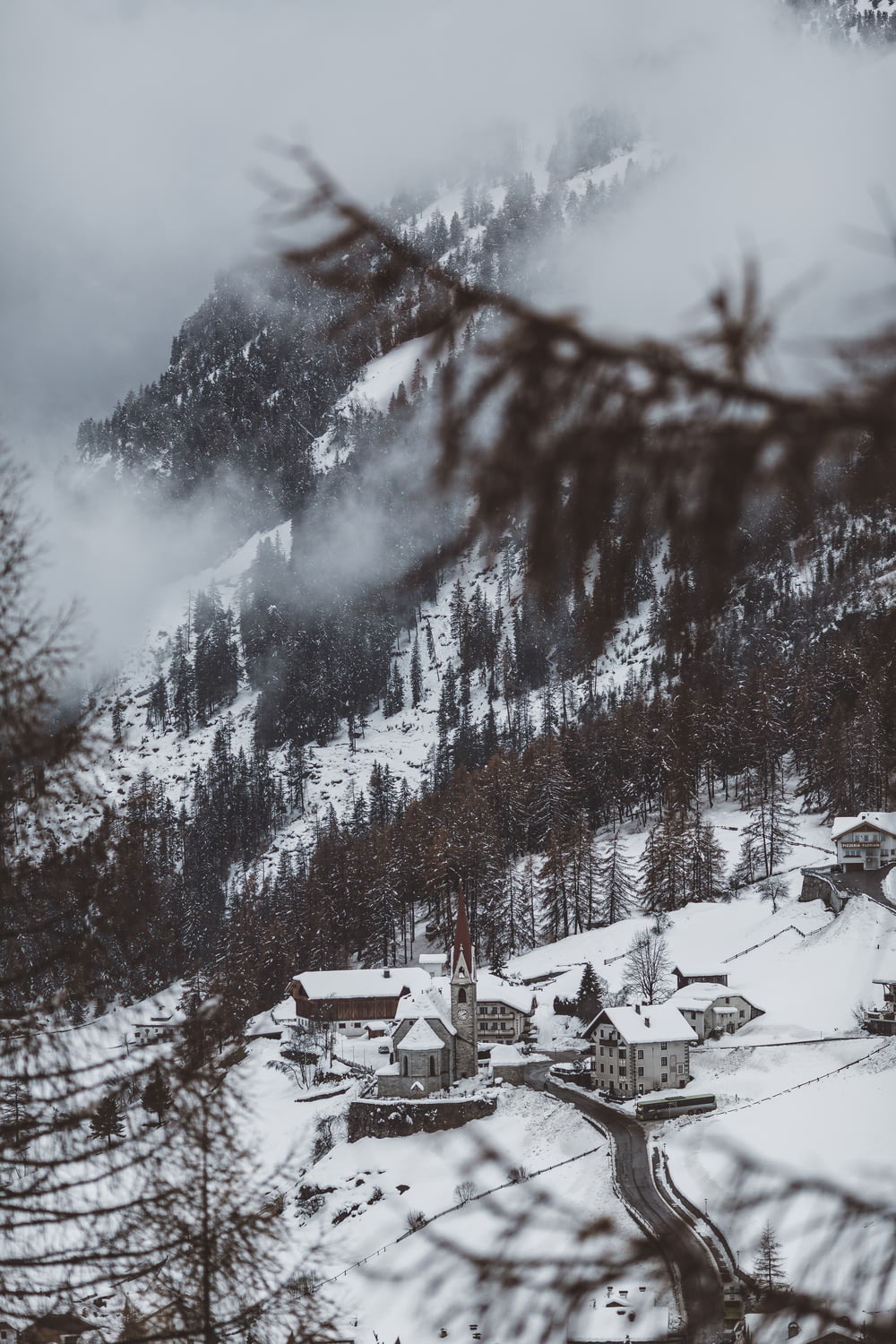 houses near mountain covered with snow