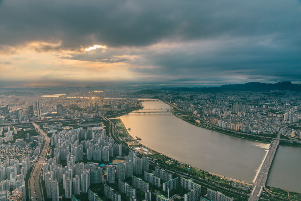 aerial photography of city skyline under cloudy sky