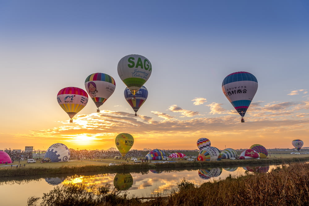 flying hot air balloons during golden hour