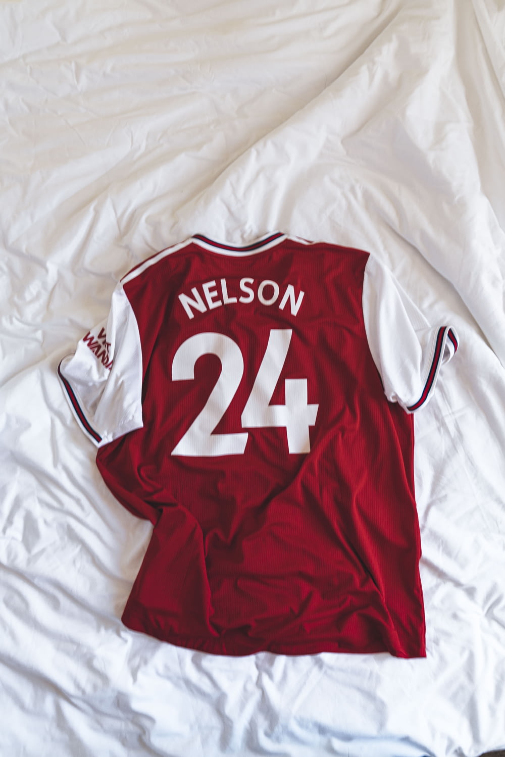 red and white Nelson 24 jersey shirt