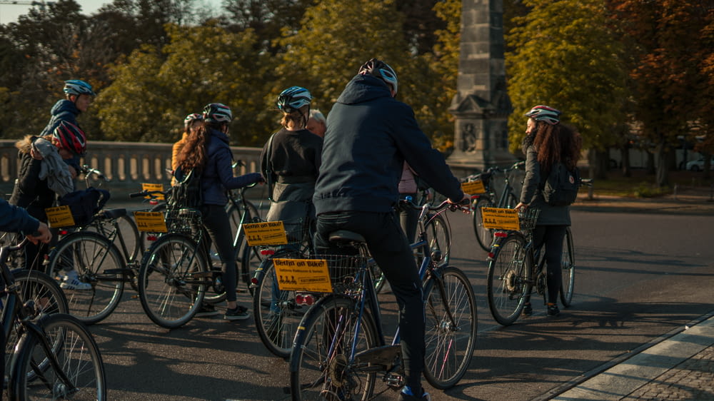 shallow focus photo of people riding bike