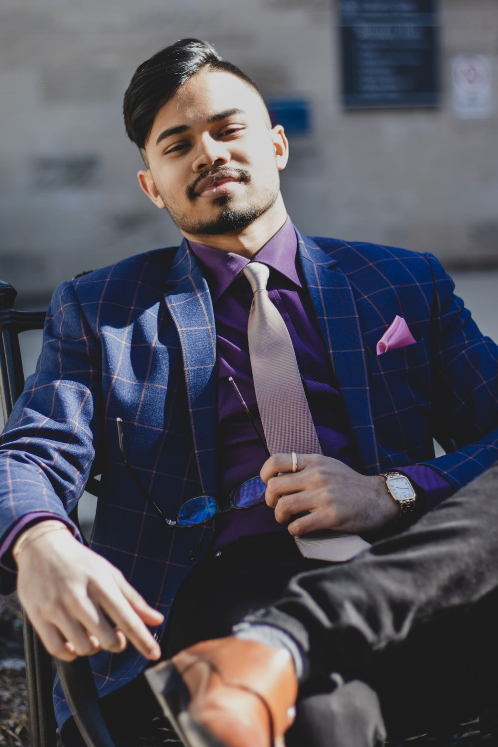 man wearing blue checkered suit