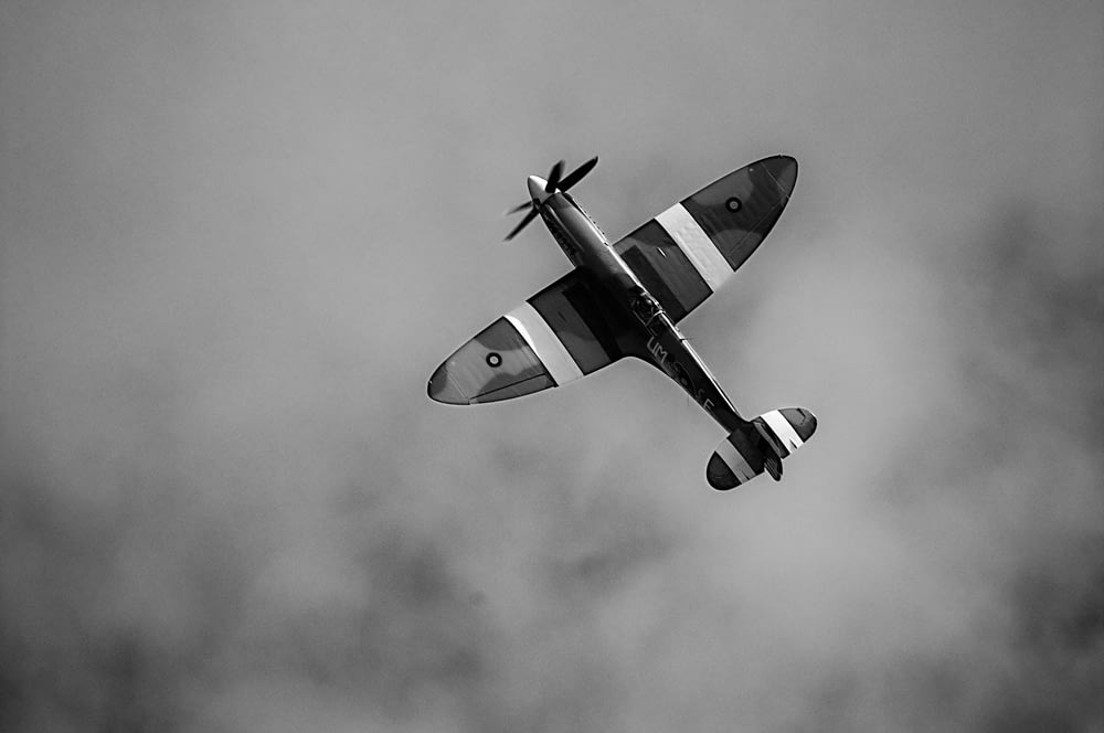 grayscale photography of plane in the sky