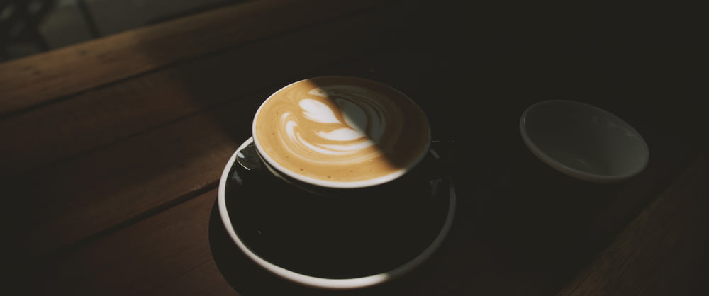 latte on black mug