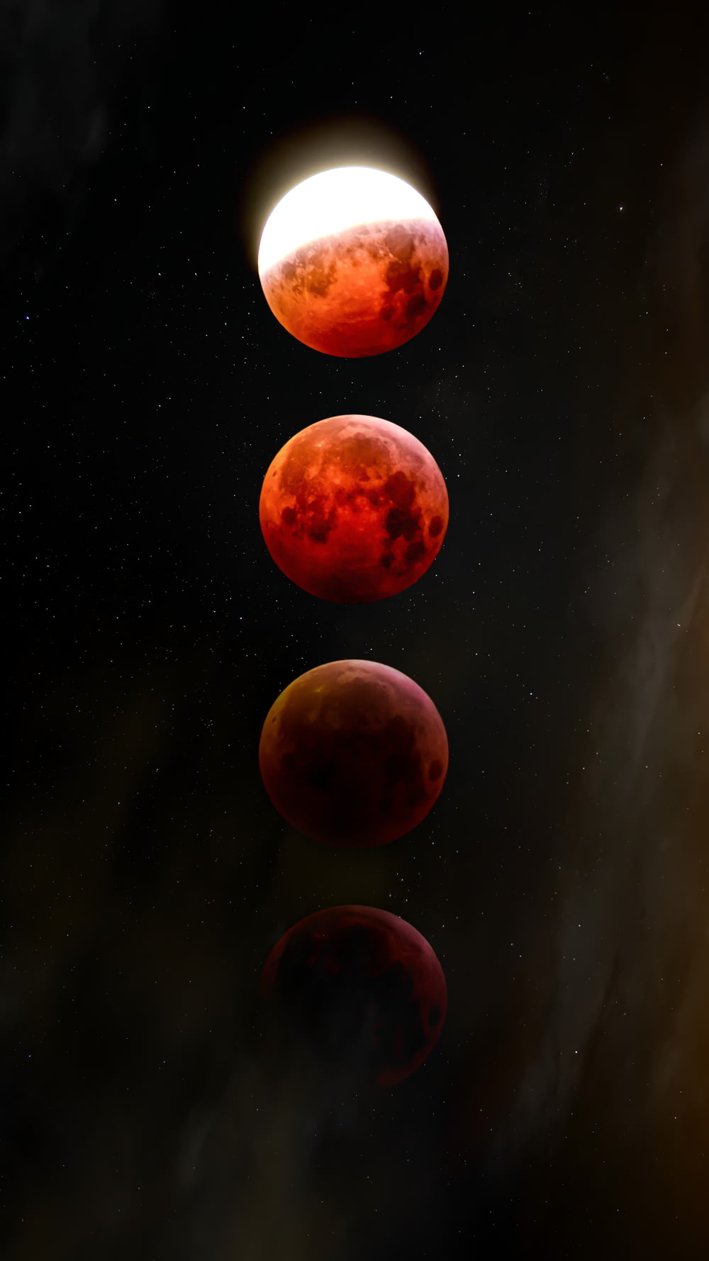 un groupe de planètes rouges flottant dans le ciel