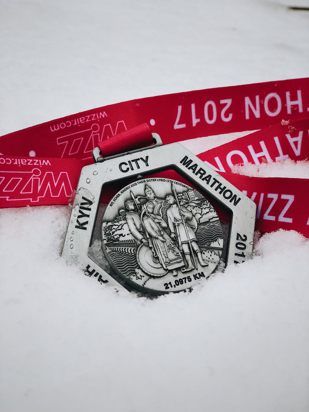 gray Marathon medal with pink lanyard