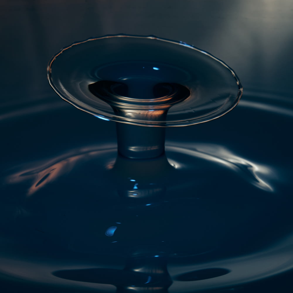 a drop of water that is floating in the water