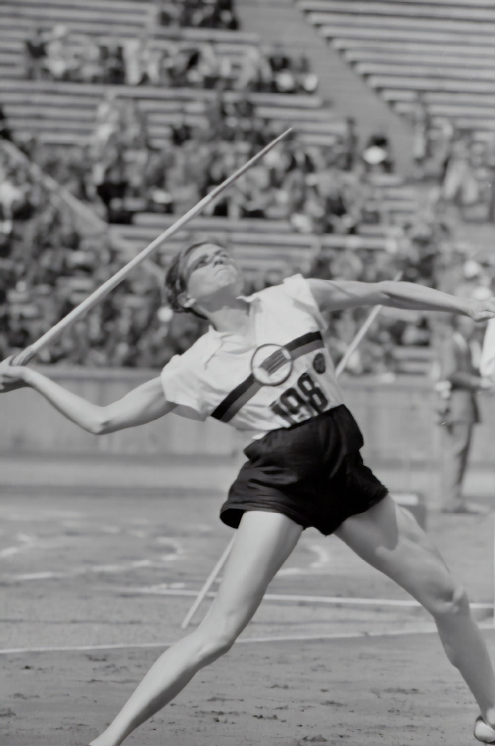 woman doing javelin throw photograph