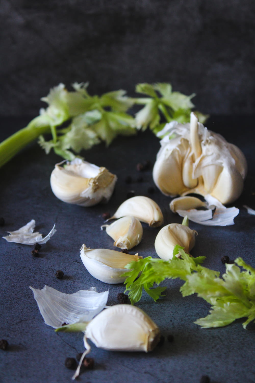 white garlic on black table