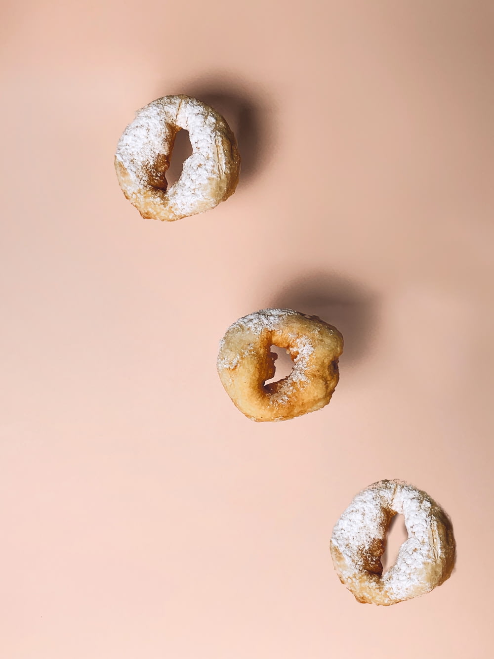 white doughnut on brown surface