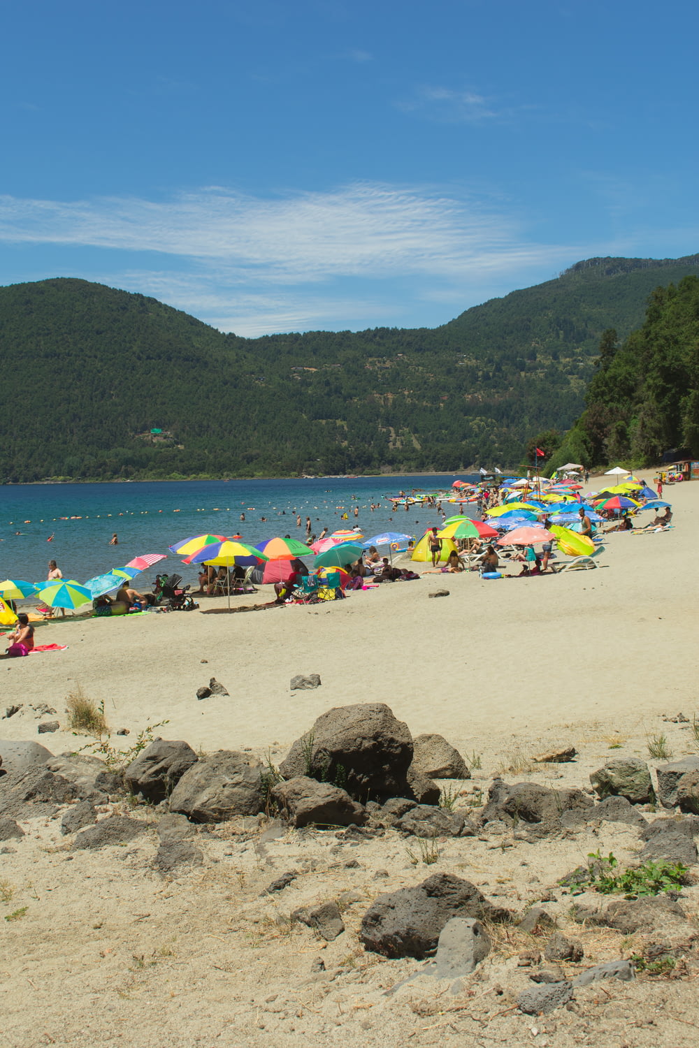 a beach filled with lots of colorful umbrellas