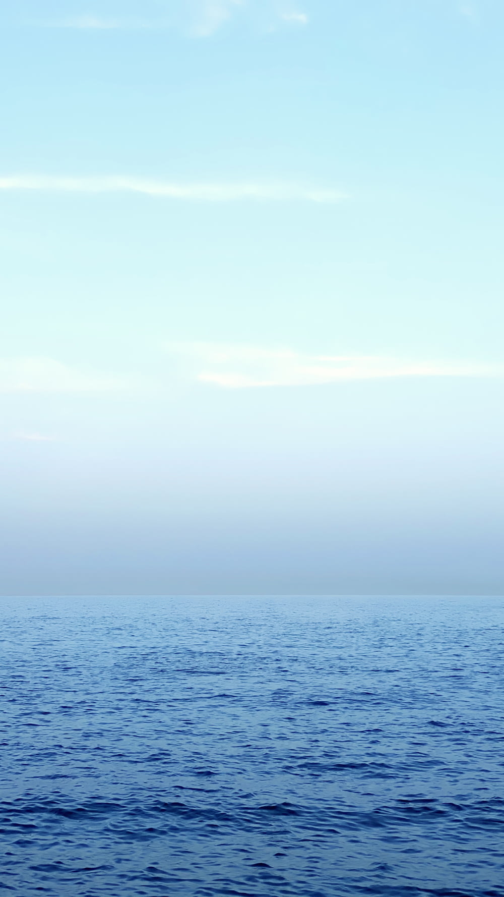 blue sea under white sky during daytime