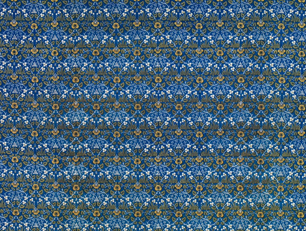 blue and yellow floral textile