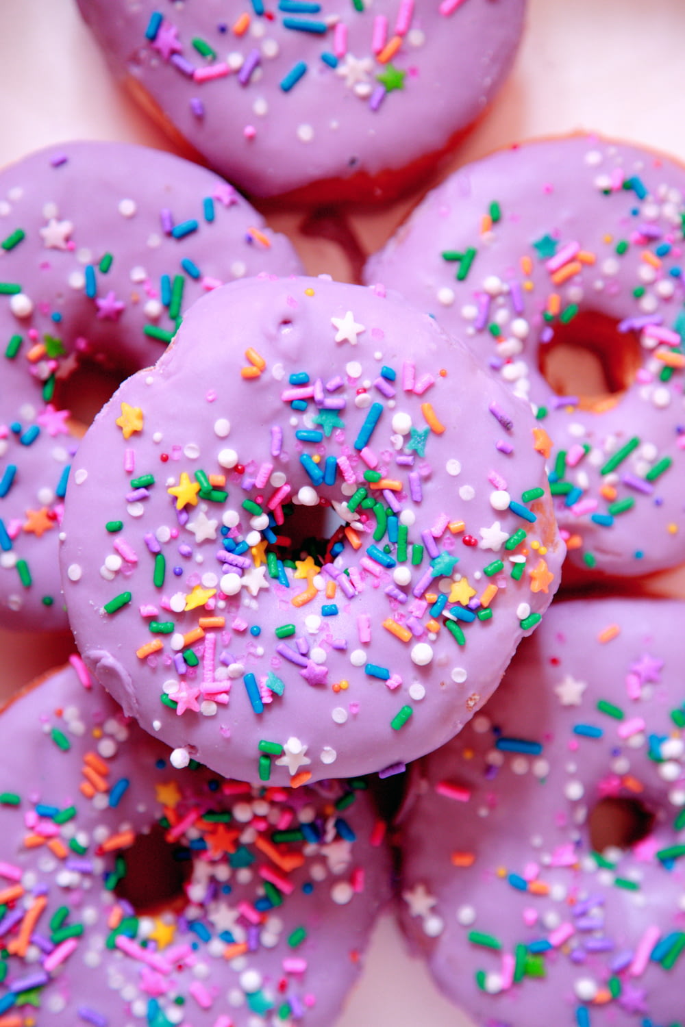 pink and white doughnut with sprinkles