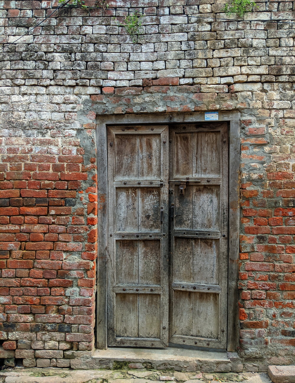 brown wooden window on brown brick wall