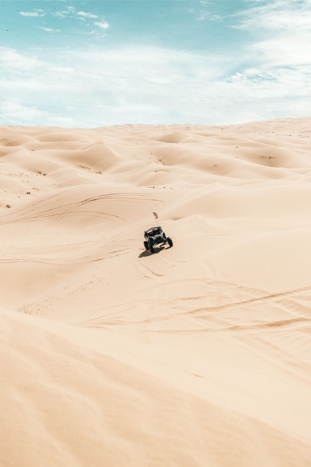 black and white car on desert during daytime