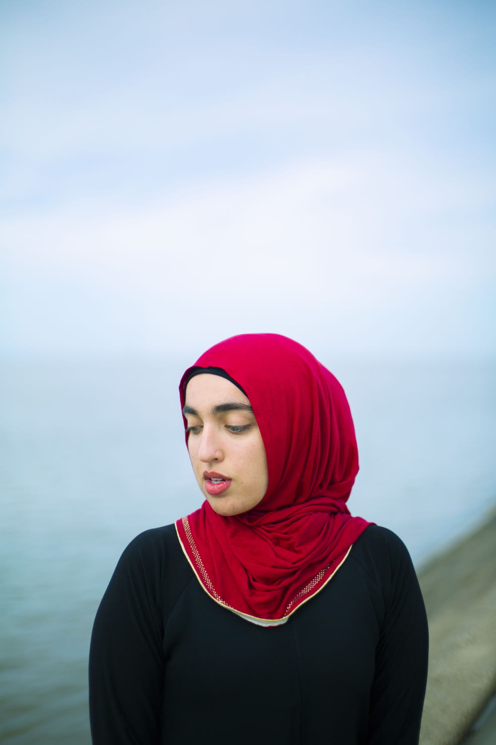 woman in red hijab and black long sleeve shirt