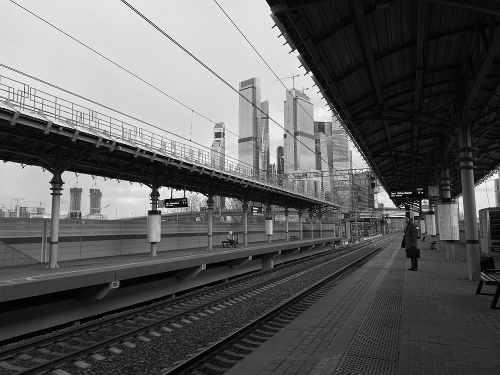 grayscale photo of train rail