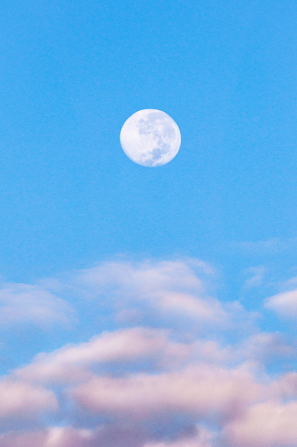 full moon in blue sky